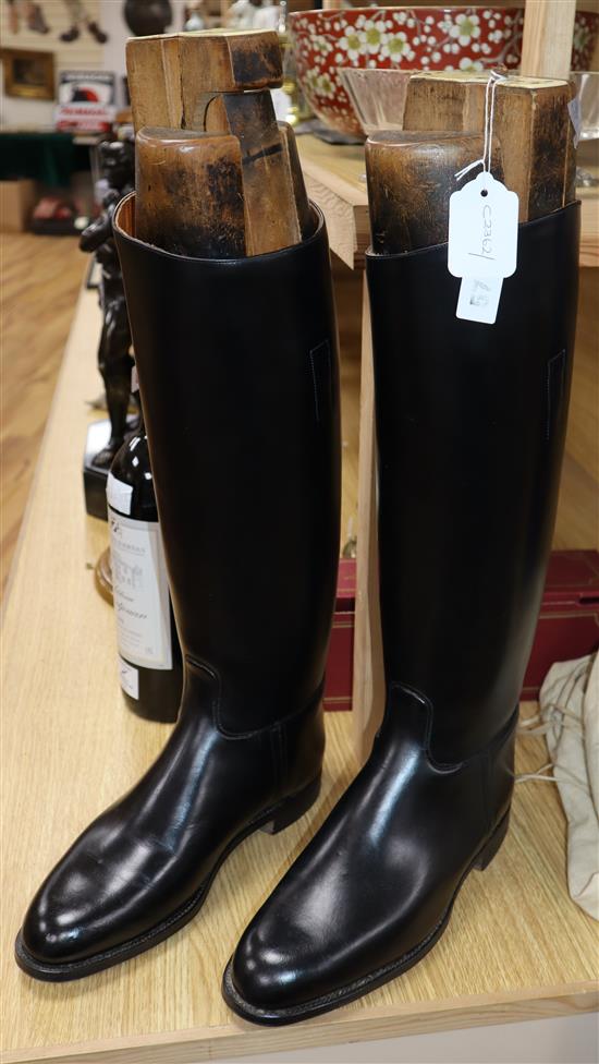 A pair of black leather riding boots, the trees bearing ivorine plaques inscribed Viscount Hastings/Peal & Co, London,